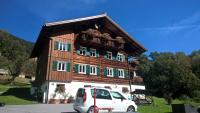 a white van parked in front of a house at Haus Silke in Silbertal