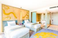 a bedroom with two beds and a bathroom at Crowne Plaza Vientiane by IHG in Vientiane