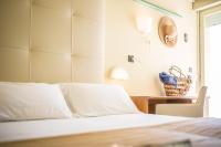 A bed or beds in a room at Hotel Royal