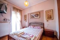 Łóżko lub łóżka w pokoju w obiekcie Holidays Pelion