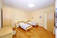 Postel nebo postele na pokoji v ubytování Apartman Antonio