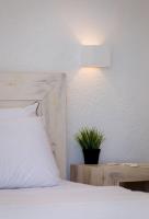 Posteľ alebo postele v izbe v ubytovaní Pahivouni Studios & Suites