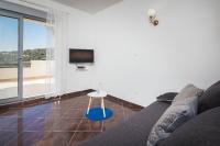 Televízia a/alebo spoločenská miestnosť v ubytovaní Apartments Amavi