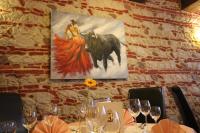 a table with a painting of a woman and a bull at Bawelsberger Hof in Dillingen an der Saar