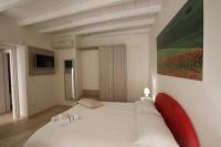 Televízia a/alebo spoločenská miestnosť v ubytovaní B&B Casa Rubis