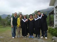 a group of people in graduation robes posing for a picture at Taroko Sialin Coffee Farm Homestay in Xiulin
