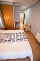 Posteľ alebo postele v izbe v ubytovaní Hotel El Roble