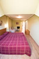 Posteľ alebo postele v izbe v ubytovaní Hotel El Roble