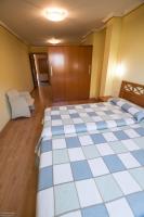 Posteľ alebo postele v izbe v ubytovaní Hotel El Roble