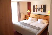 Ein Bett oder Betten in einem Zimmer der Unterkunft Hotel Riezler Hof
