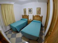 Posteľ alebo postele v izbe v ubytovaní Apartamentos Niña de Oro