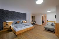 Postel nebo postele na pokoji v ubytování Dreimäderlhaus - Das vegetarische Boutique Hotel