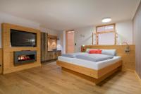 Postel nebo postele na pokoji v ubytování Dreimäderlhaus - Das vegetarische Boutique Hotel