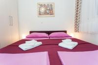Posteľ alebo postele v izbe v ubytovaní Apartments Palma Ragusa