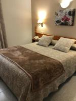 Cama o camas de una habitación en Hostal Alcázar