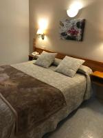 Cama o camas de una habitación en Hostal Alcázar