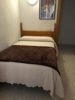 Cama o camas de una habitación en Hostal Alcázar