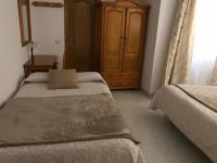Cama o camas de una habitación en Hostal Alcázar