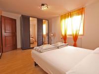 Postel nebo postele na pokoji v ubytování Apartments Denis 19