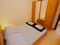 Postel nebo postele na pokoji v ubytování Apartments Denis 19