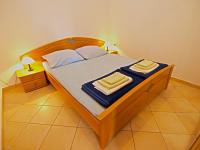 Postel nebo postele na pokoji v ubytování Apartments Denis 19