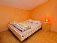 Postel nebo postele na pokoji v ubytování Apartments Denis 19