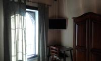 Televízia a/alebo spoločenská miestnosť v ubytovaní Villa Anna Bed & Breakfast