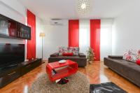 Televízia a/alebo spoločenská miestnosť v ubytovaní Roman Forum Apartments