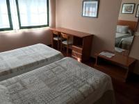Posteľ alebo postele v izbe v ubytovaní Hostal La Frontera