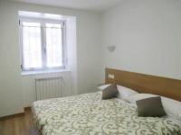 Posteľ alebo postele v izbe v ubytovaní Apartamentos Grosen