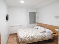 Posteľ alebo postele v izbe v ubytovaní Apartamentos Grosen