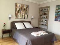 a bedroom with a bed with two pillows on it at 1 Square du Docteur Blanche - Paris 16 in Paris