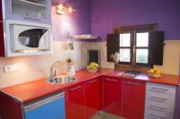 Kuchyň nebo kuchyňský kout v ubytování Apartamentos La Iguana