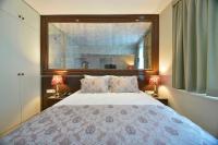 A bed or beds in a room at Adamel City Hotel