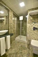 A bathroom at Adamel City Hotel