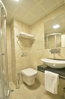 A bathroom at Adamel City Hotel