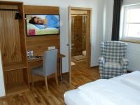 Postel nebo postele na pokoji v ubytování Hotel Fischachstubn
