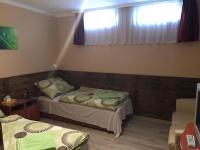 Posteľ alebo postele v izbe v ubytovaní Abszolút Hotel és Panzió