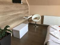 Posteľ alebo postele v izbe v ubytovaní Abszolút Hotel és Panzió