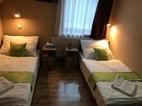 Posteľ alebo postele v izbe v ubytovaní Abszolút Hotel és Panzió