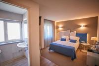 Posteľ alebo postele v izbe v ubytovaní Hotel Boa Vista