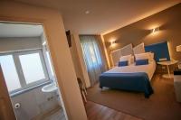 Posteľ alebo postele v izbe v ubytovaní Hotel Boa Vista