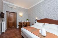 A bed or beds in a room at Suite Beccaria A Piazza Del Popolo