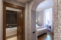 A bed or beds in a room at Suite Beccaria A Piazza Del Popolo