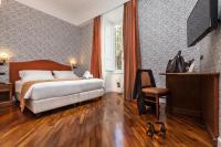 A bed or beds in a room at Suite Beccaria A Piazza Del Popolo