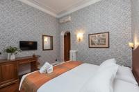 A bed or beds in a room at Suite Beccaria A Piazza Del Popolo