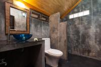 a bathroom with a toilet and a sink at Palm Leaf Resort Koh Tao in Ko Tao