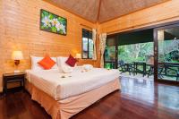 a bedroom with a large bed in a room at Palm Leaf Resort Koh Tao in Ko Tao