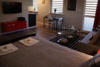 Łóżko lub łóżka w pokoju w obiekcie Friendly Apartments - Krakow