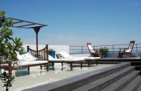 a group of chairs sitting on top of a roof at Hotel Boutique V in Vejer de la Frontera